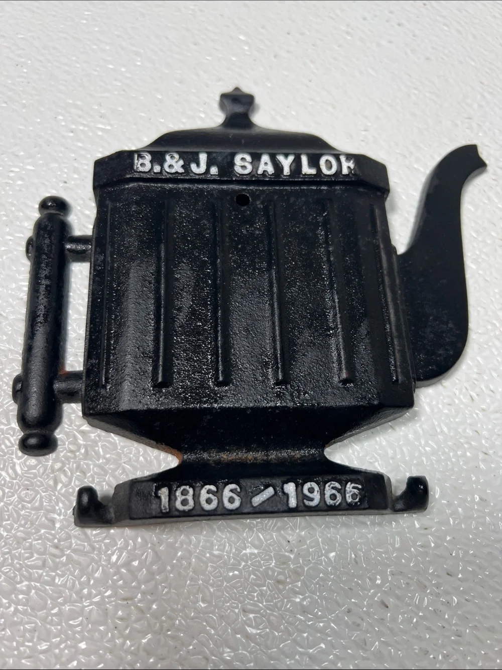B. & J. Saylok Black Cast Iron Teapot Wall Plaque - 1866-1966